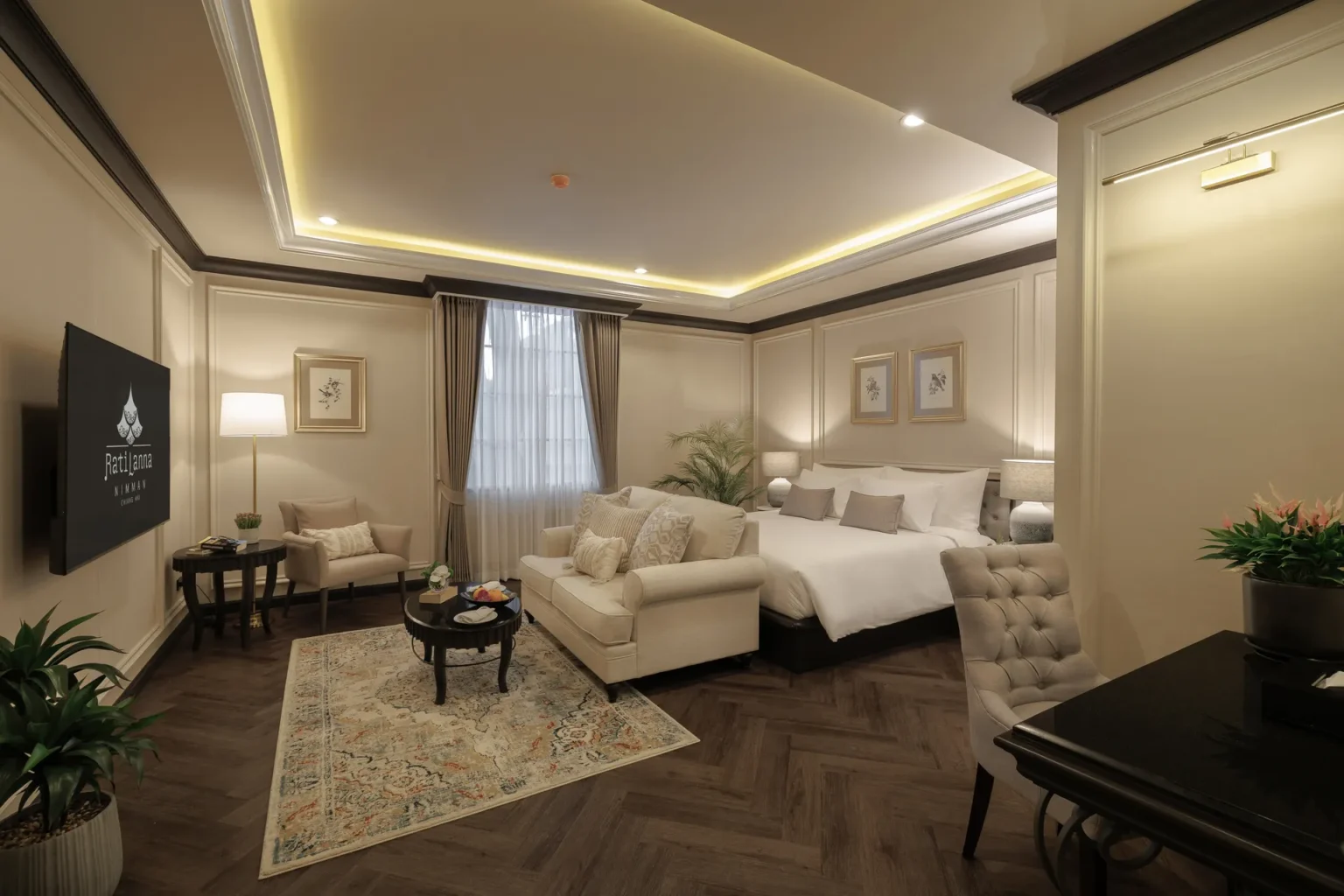 Modern Deluxe Premier bedroom with a relaxing seating area at our hotel near MAYA Chiang Mai.