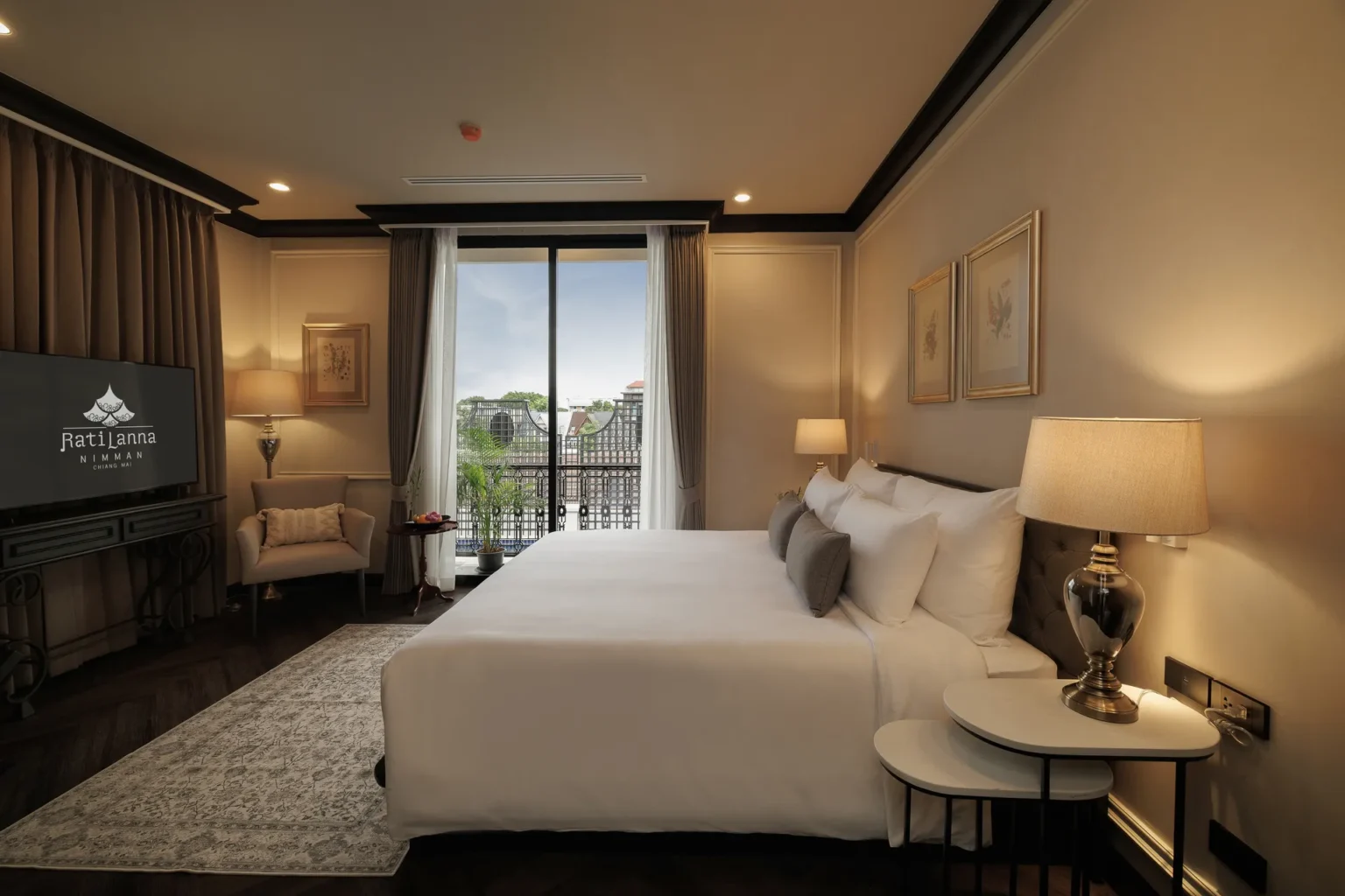 Elegant Deluxe Room with a comfortable king bed at our luxury hotel in Chiang Mai.